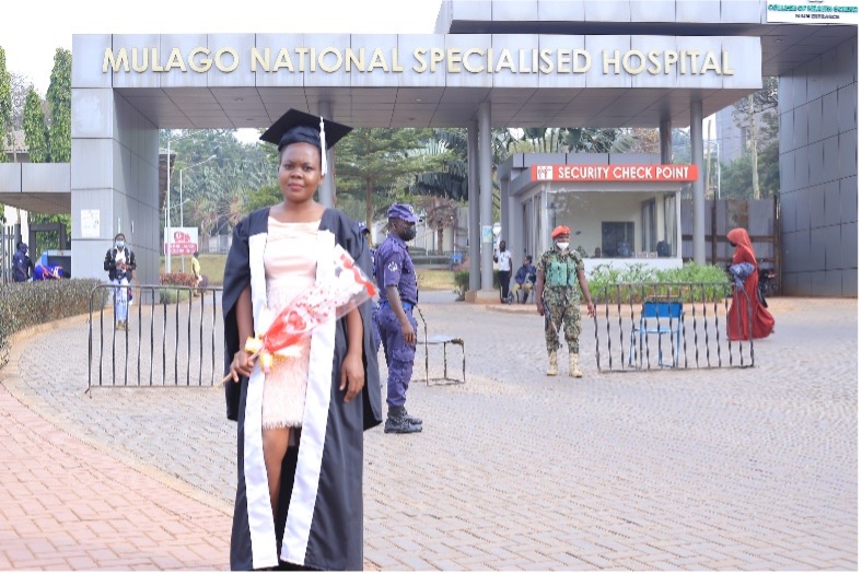 Graduate at the entrace of Uganda’s main National Hospital